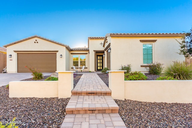 mediterranean / spanish-style home featuring a garage