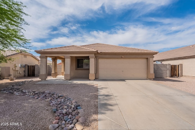 2518 W Carson Rd, Phoenix, AZ 85041 - view of front facade featuring a tile roof, an attached garage, stucco siding, and concrete driveway
