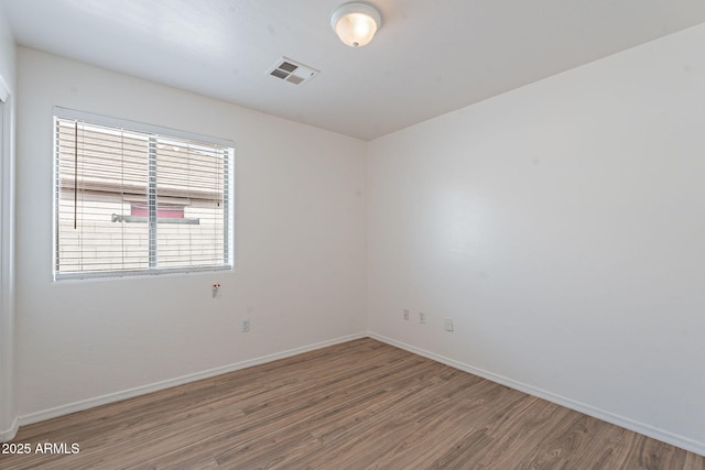 2518 W Carson Rd, Phoenix, AZ 85041 - unfurnished room with wood finished floors and baseboards