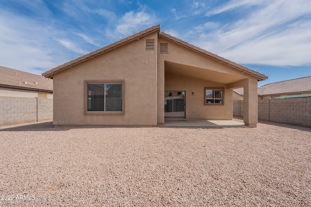 2518 W Carson Rd, Phoenix, AZ 85041 - rear view of house featuring a patio, stucco siding, and a fenced backyard