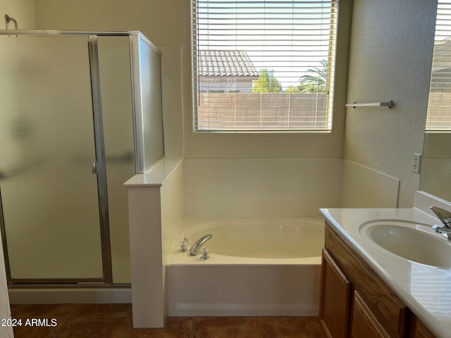 bathroom with tile patterned flooring, vanity, and independent shower and bath