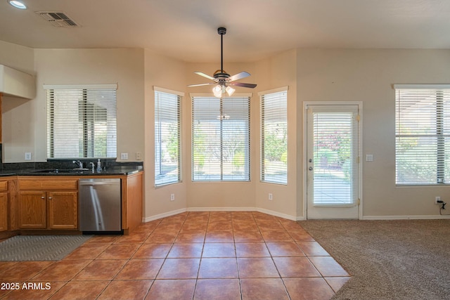 kitchen with ceiling fan, dishwasher, light tile patterned floors, and sink