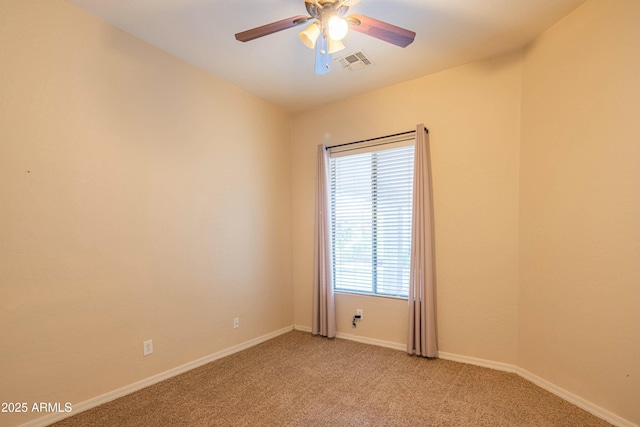 carpeted spare room with plenty of natural light and ceiling fan