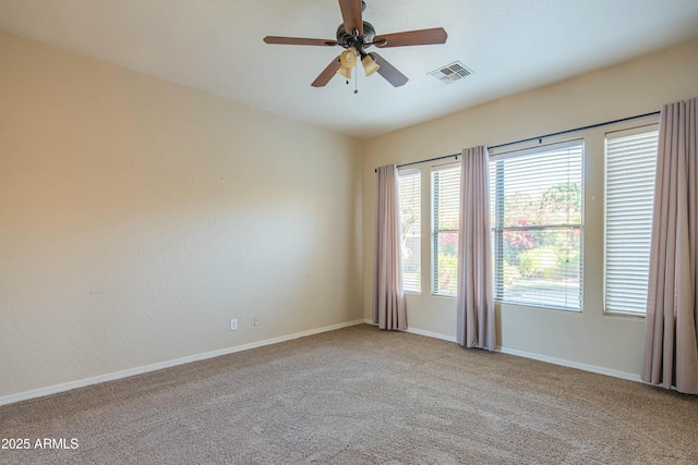 empty room with light colored carpet and ceiling fan