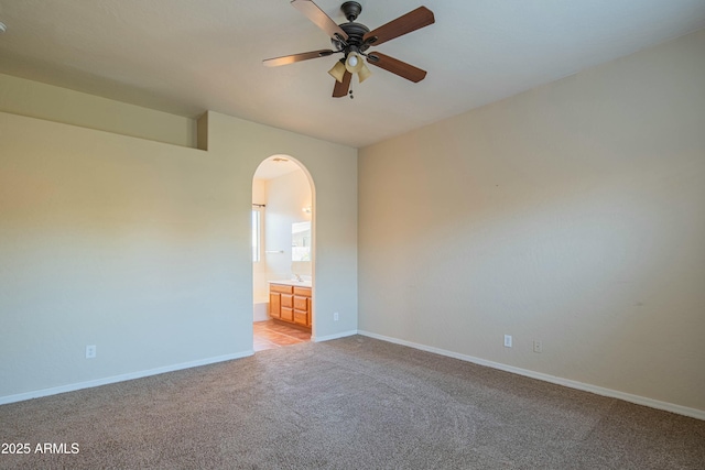 spare room with light carpet and ceiling fan