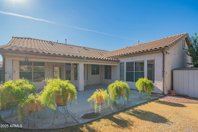 rear view of house with a patio