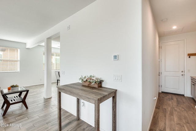 hall with light hardwood / wood-style floors