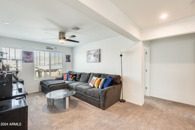 living room featuring light colored carpet and ceiling fan