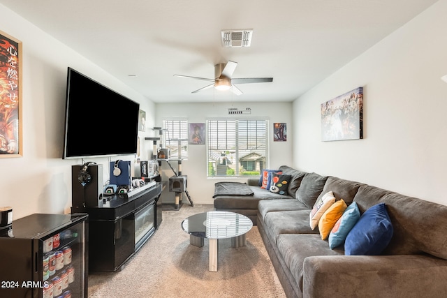 carpeted living room featuring ceiling fan