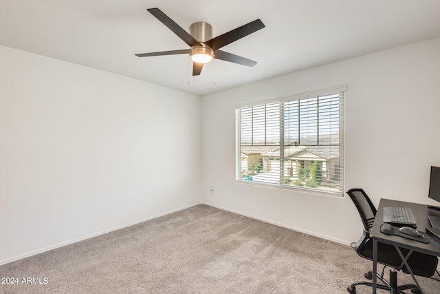 office space with light colored carpet and ceiling fan