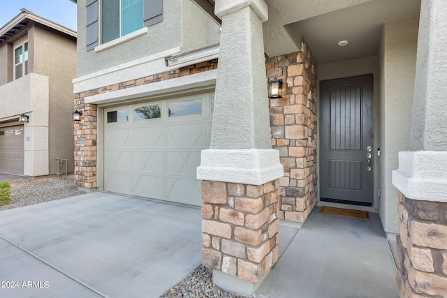 entrance to property featuring a garage