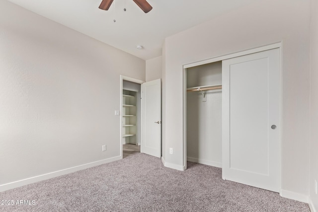 unfurnished bedroom with a closet, ceiling fan, baseboards, and carpet