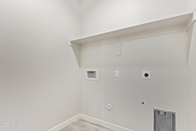 laundry area featuring electric dryer hookup, washer hookup, hookup for a gas dryer, baseboards, and laundry area