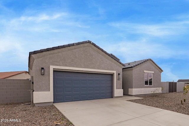 single story home with fence, stucco siding, concrete driveway, a garage, and a tiled roof