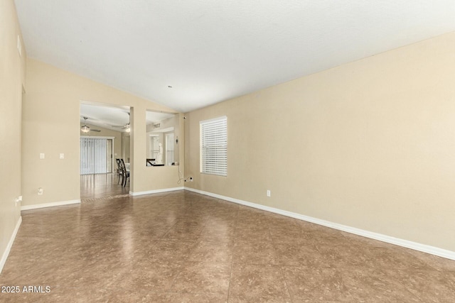 empty room featuring lofted ceiling