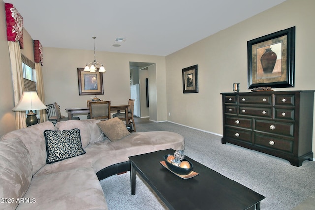 living room with carpet and a notable chandelier