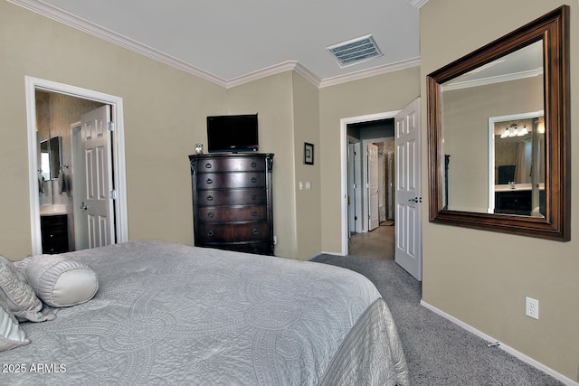 carpeted bedroom featuring crown molding and ensuite bath