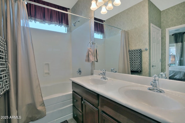 bathroom featuring shower / tub combo with curtain and vanity