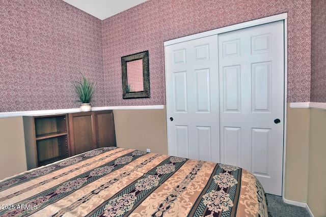 bedroom with a closet and carpet