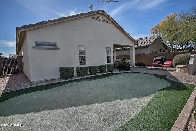 rear view of house with a patio