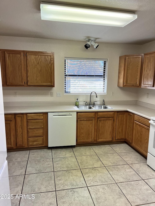 100 N Lariat Way, Payson, AZ 85541 - kitchen with dishwasher, a sink, brown cabinets, and light countertops