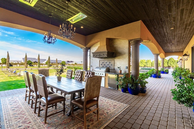 view of patio / terrace featuring outdoor dining space, visible vents, an outdoor kitchen, and area for grilling