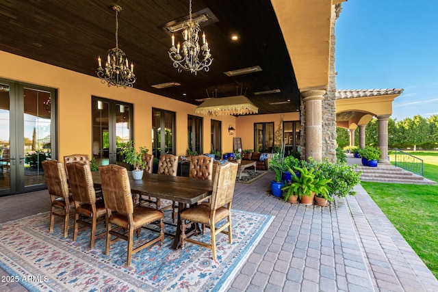 view of patio with french doors and outdoor dining space