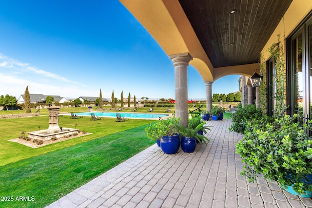 view of patio featuring a community pool