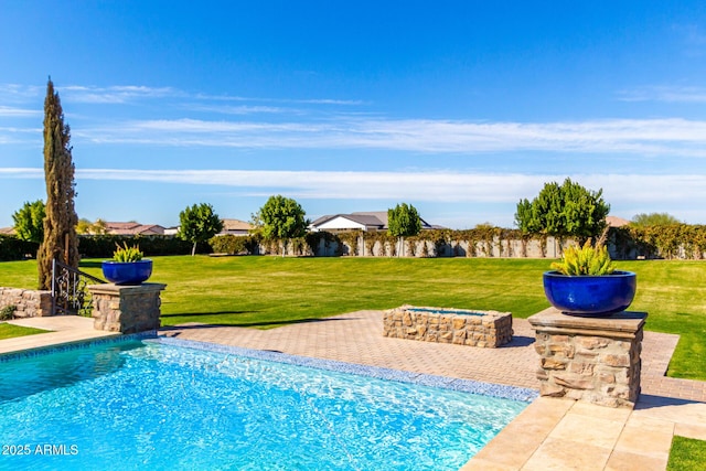 view of swimming pool with a lawn and a fenced in pool