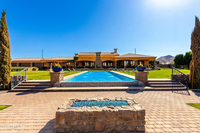 outdoor pool with a lawn