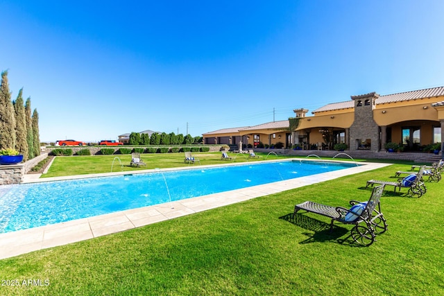 outdoor pool with a lawn