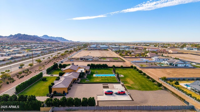 drone / aerial view featuring a residential view and a mountain view