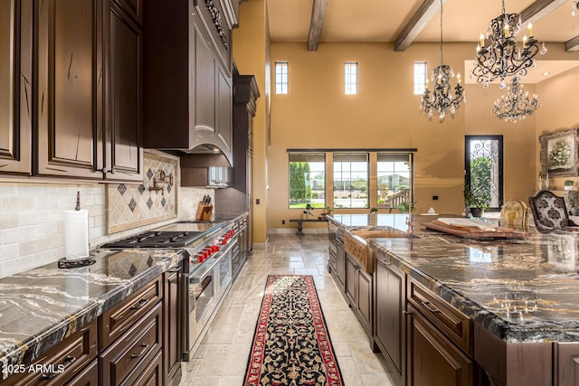 kitchen featuring pendant lighting, double oven range, and dark brown cabinetry