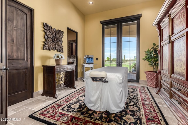 living area featuring recessed lighting and french doors