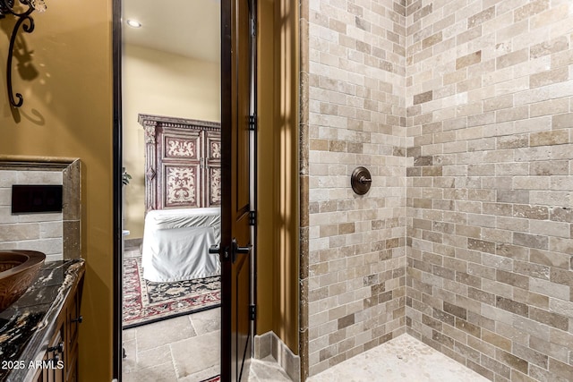 bathroom with stone tile flooring, tiled shower, and ensuite bath