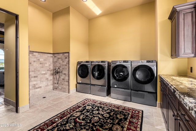 washroom with recessed lighting, cabinet space, and washer and clothes dryer