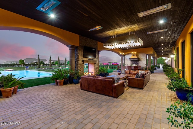 view of patio featuring an outdoor living space and an outdoor pool