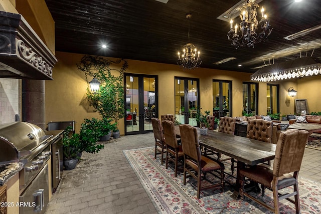 view of patio featuring exterior kitchen, french doors, area for grilling, and outdoor dining space