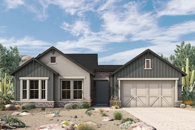 modern farmhouse with driveway, an attached garage, and board and batten siding