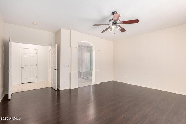 2741 E San Tan St, Chandler, AZ 85225 - unfurnished room with ceiling fan, wood finished floors, and arched walkways