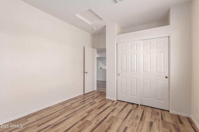 2741 E San Tan St, Chandler, AZ 85225 - unfurnished bedroom featuring attic access, light wood finished floors, and a closet