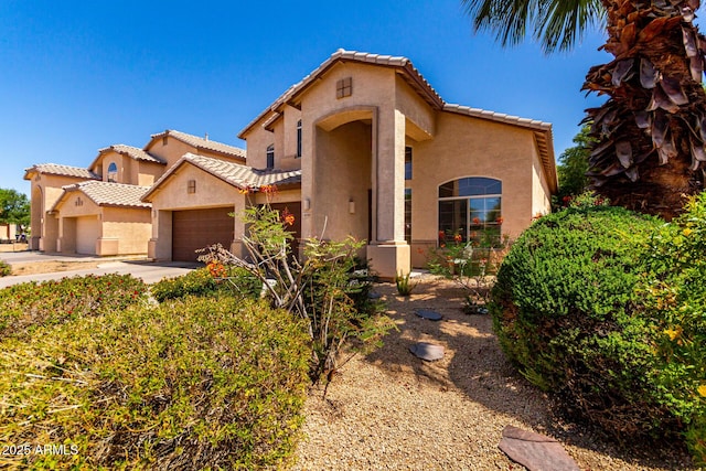 2741 E San Tan St, Chandler, AZ 85225 - mediterranean / spanish-style house featuring a tile roof, stucco siding, a garage, and concrete driveway