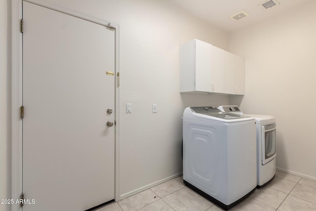 2741 E San Tan St, Chandler, AZ 85225 - laundry area featuring washer and clothes dryer, cabinet space, and light tile patterned floors