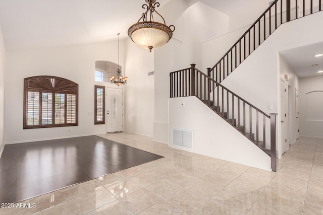 2741 E San Tan St, Chandler, AZ 85225 - entryway with high vaulted ceiling, a chandelier, and stairs