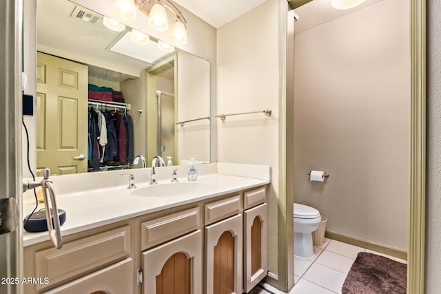 full bathroom featuring visible vents, toilet, a stall shower, tile patterned flooring, and vanity