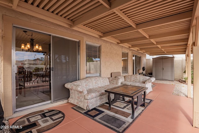 view of patio with a storage unit and an outdoor structure