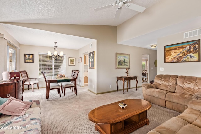 living area featuring vaulted ceiling, plenty of natural light, visible vents, and light carpet