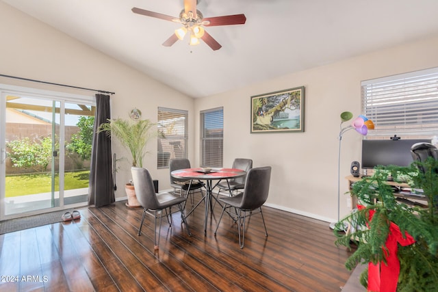 dining room with lofted ceiling, dark wood-type flooring, and ceiling fan