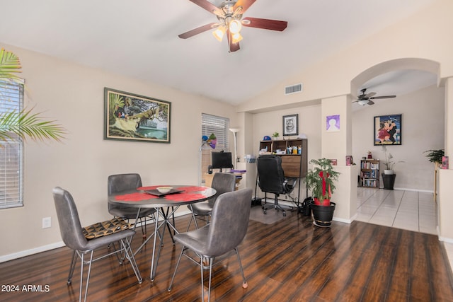 dining area with ceiling fan, hardwood / wood-style flooring, and lofted ceiling