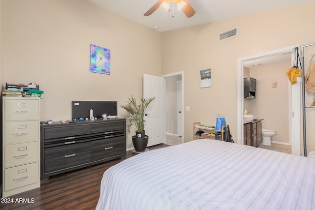 bedroom featuring connected bathroom, ceiling fan, and dark hardwood / wood-style floors